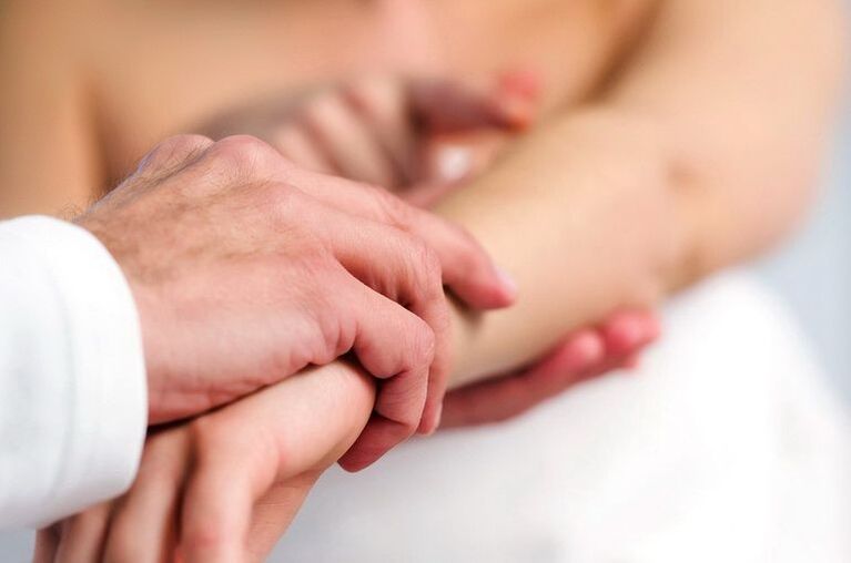 Dermatologist examining psoriasis patient